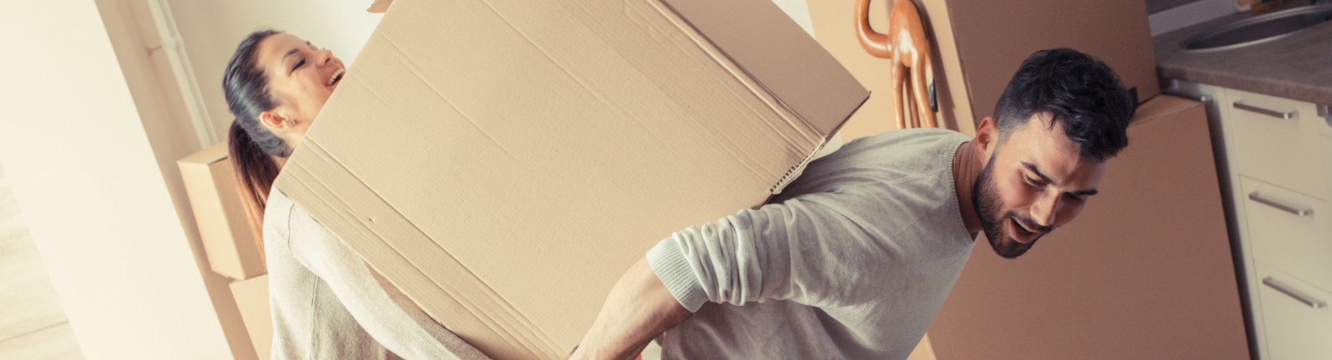 a couple with moving boxes