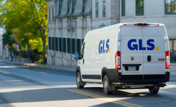 GLS parcel van driving along city streets in Old Quebec
